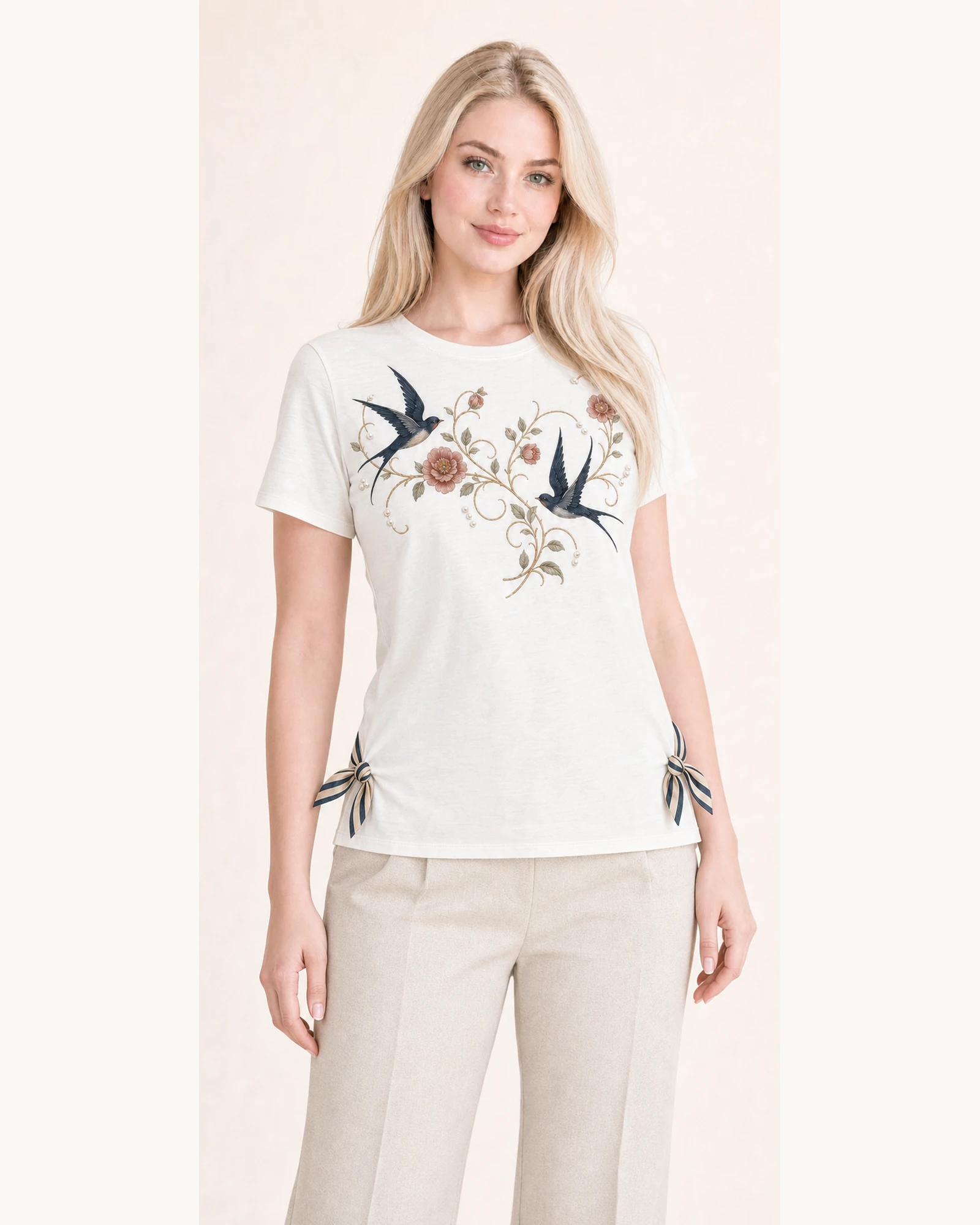 Custom Women’s Swallow Floral Side-Tie T-Shirt — VTTS-0012 Model wearing VTTS-0012 ivory swallow floral side-tie t-shirt, close view