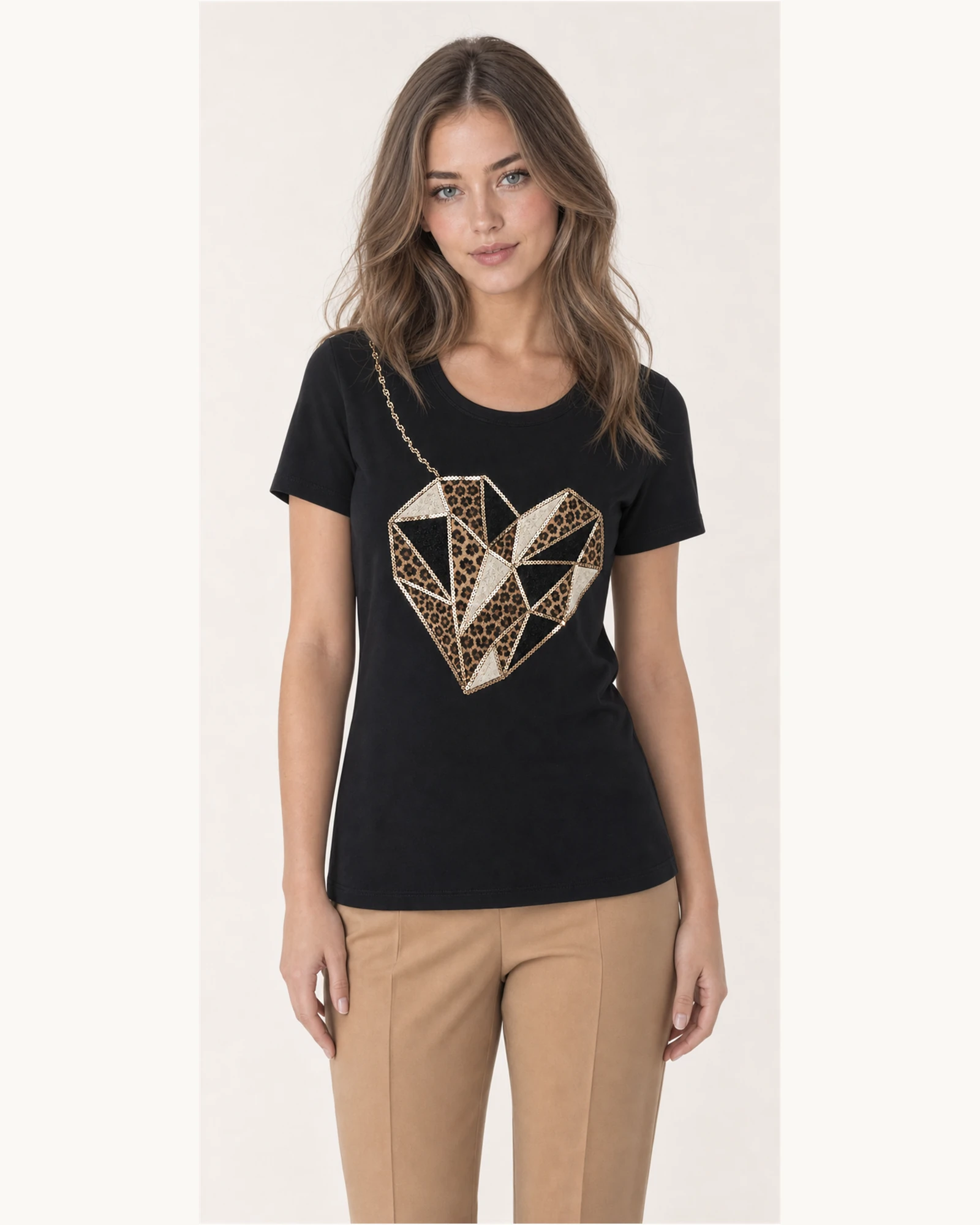 Custom Women’s Rhinestone Geometric Heart T-Shirt — VTTS-0018 Model wearing VTTS-0018 black rhinestone heart t-shirt, close view