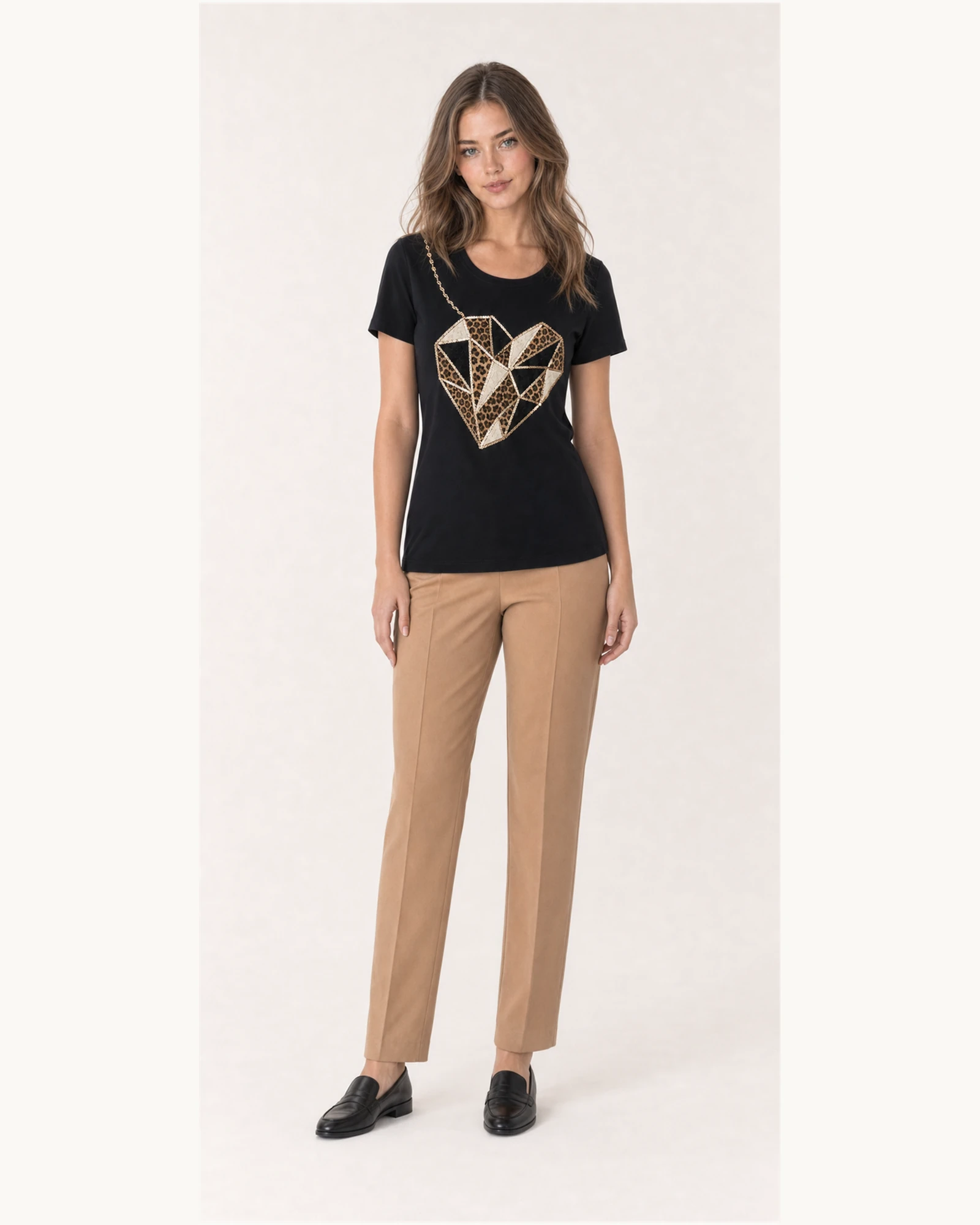Custom Women’s Rhinestone Geometric Heart T-Shirt — VTTS-0018 Full-body model wearing VTTS-0018 black rhinestone heart t-shirt