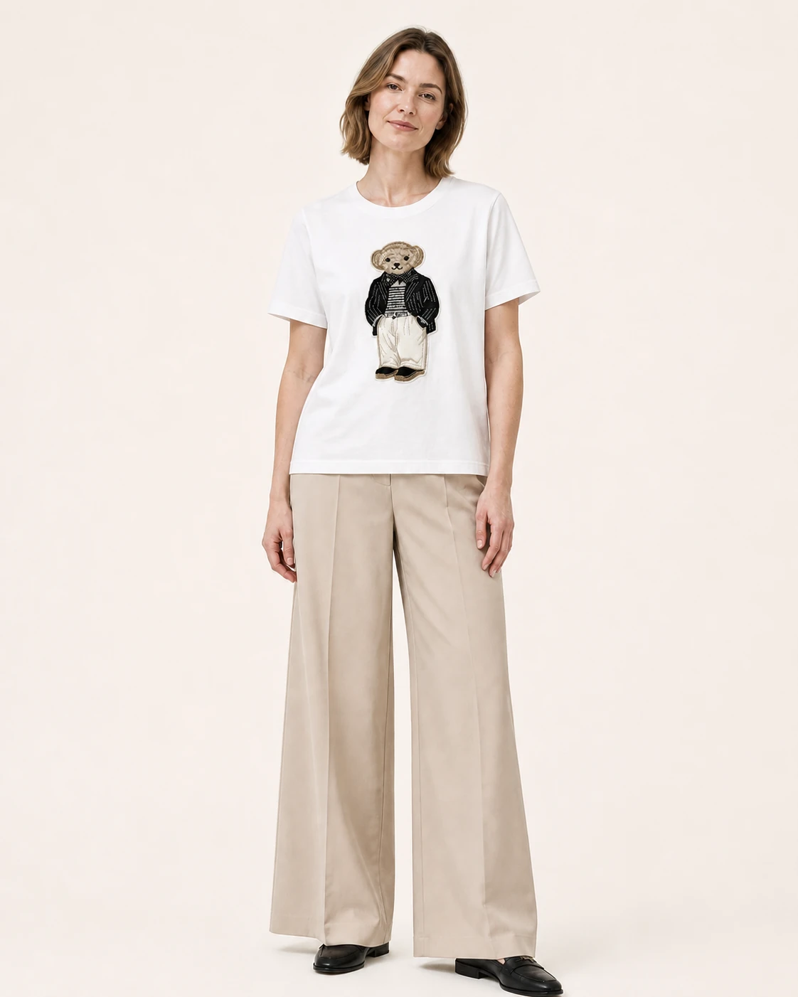 Model wearing the white VTTS-0028 pinstripe bear embroidered T-shirt