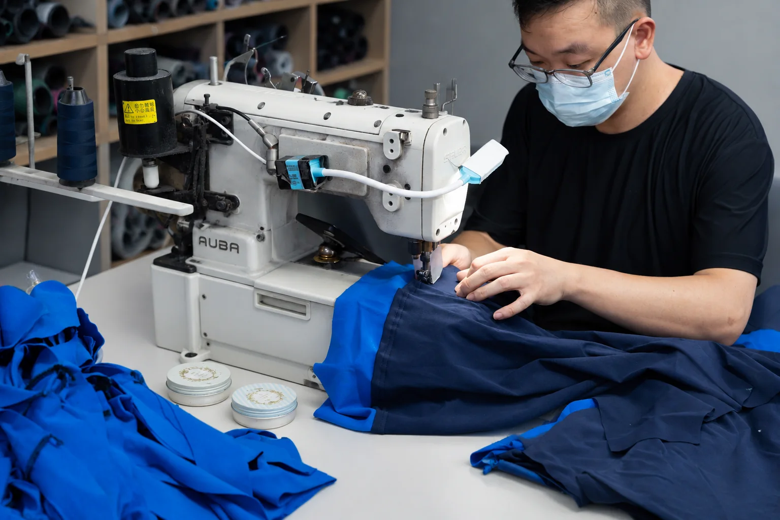 About Vanty Garment — Women’s Apparel Manufacturer Garment sewing operator working with an industrial machine