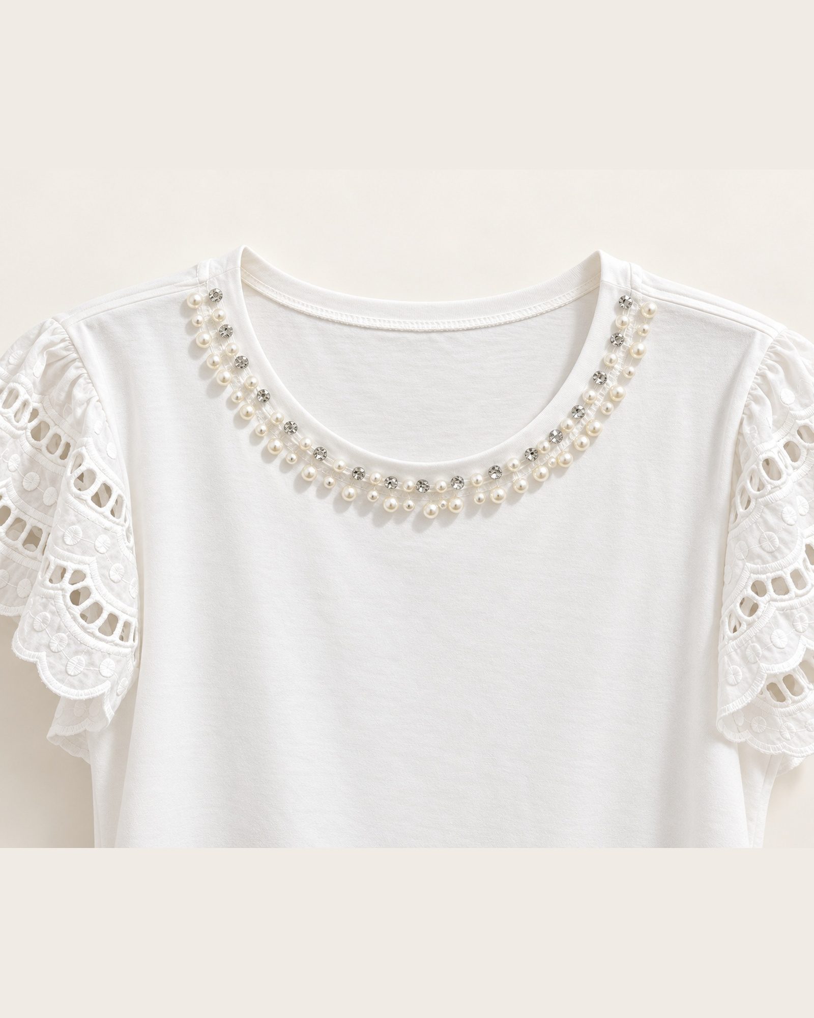 Close-up of the scalloped lace sleeves with a decorative neckline trim on VTTS-0049
